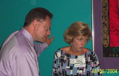 Mark and his wife, Sherri, listen intently