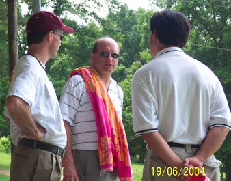 Steve, Bill, and Nelson (Kerry,) move outside after lunch and visit while the kids swim