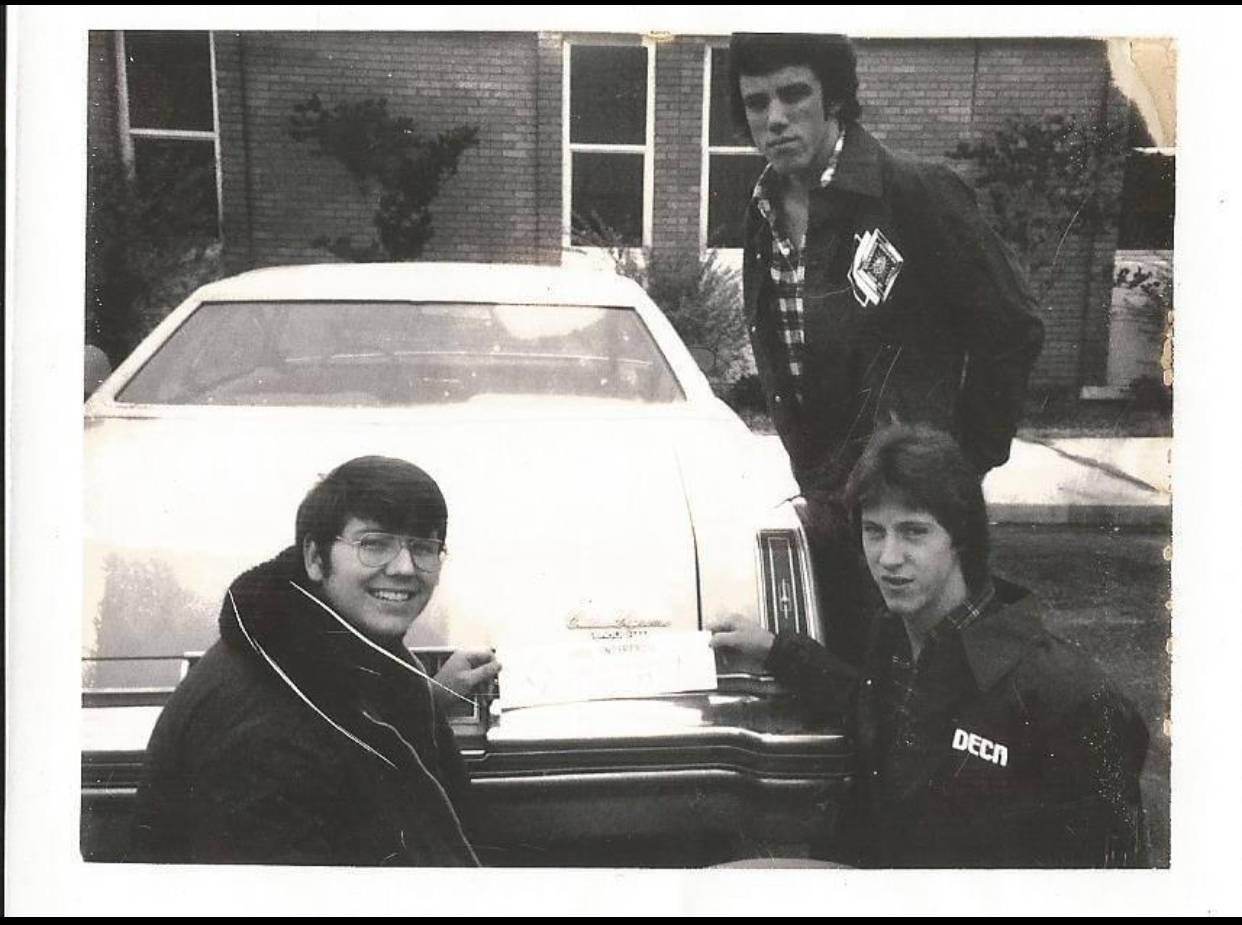 Kenn Tate, Kerry Ricks and Tracey Tait taking a photo by Miss Jane Lauderdales car. Not sure what is in the envelope!  I hope not grades! ????